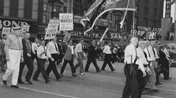 Members of Ford Local 600 of the CIO march in the Labor Day parade in Detroit Michigan, 1942. (Library of Congress Prints and Photographs Division)