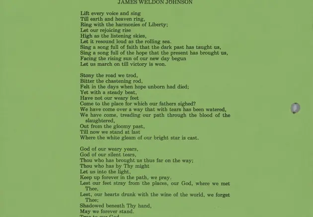 A printed conference program of black text on a green background.