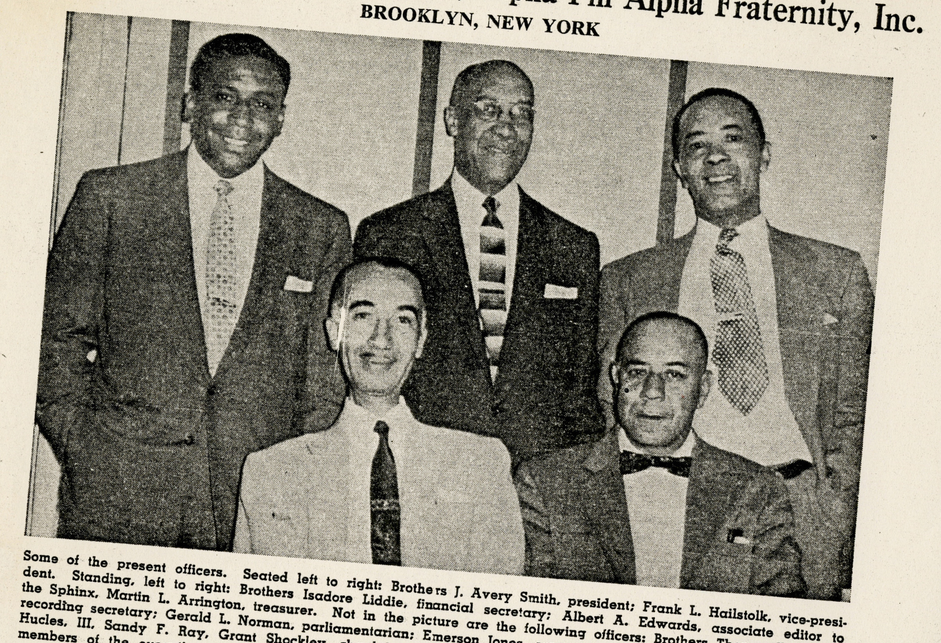 A page from a newsletter featuring a photograph with five Black men wearing suits and ties, three standing above two seated.