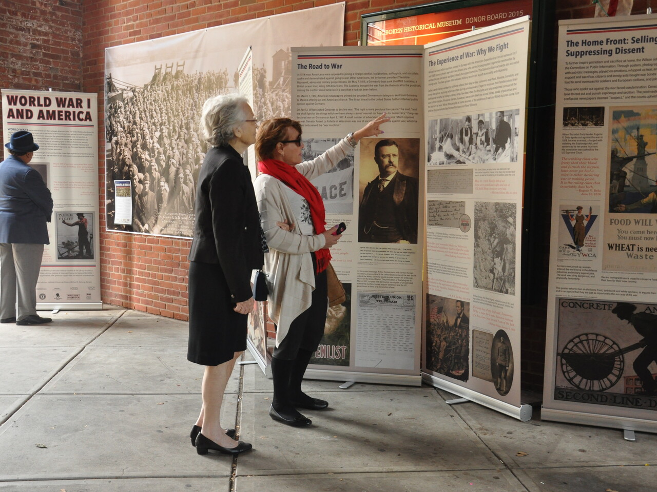 Two people view the WWI exhibition on display