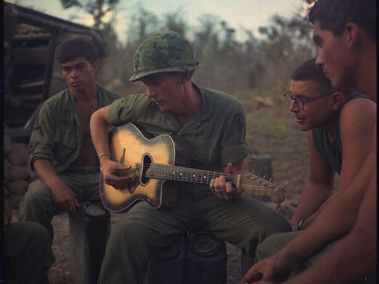 Members of the 22nd Infantry (Mechanized) gather at the end of the day in Vietnam, January 18, 1968 (National Archives)