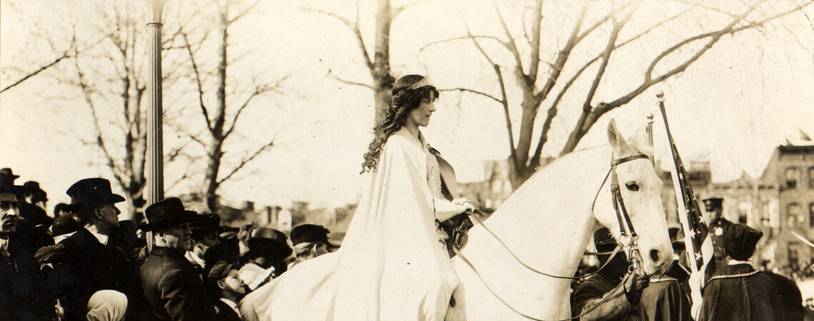 Photo shows lawyer Inez Milholland Boissevain riding astride in the March 3, 1913, suffrage parade in Washington, D.C., as the first of four mounted heralds.