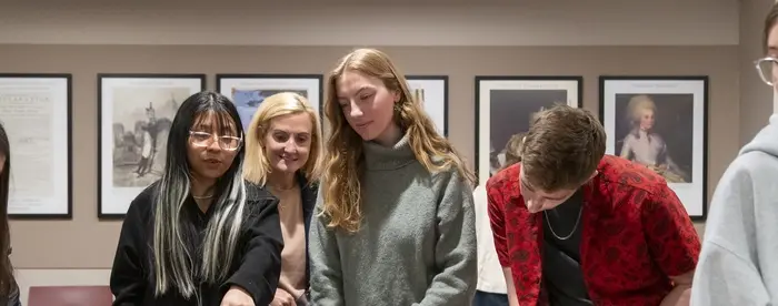 McCormick Family Foundation–Gilder Lehrman Scholars Elisabet Guerrero Hernandez '25, Olivia Korach '26, and Ethan Roy '26 review documents from the Gilder Lehrman Collection.