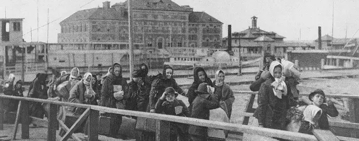 Line of immigrants landing at Ellis Island, 1902