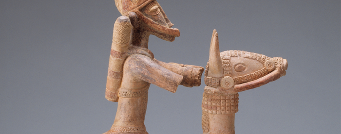 Stylized clay sculpture of an armored soldier on a horse
