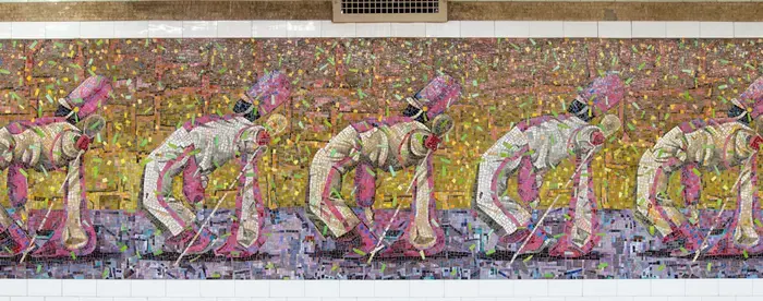 A tile mosaic in a subway station of drum majors in white uniforms dancing in formation.