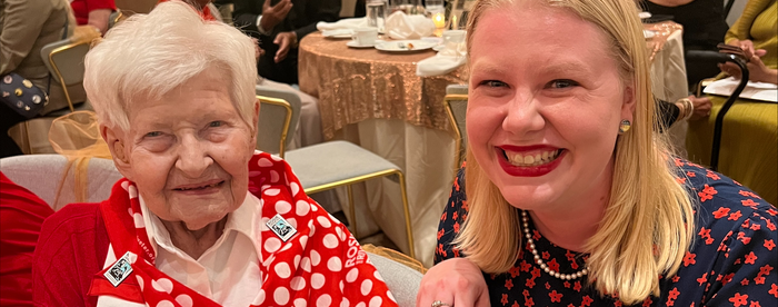 Kate Corrado sits next to a real-life Rose the Riveter. 