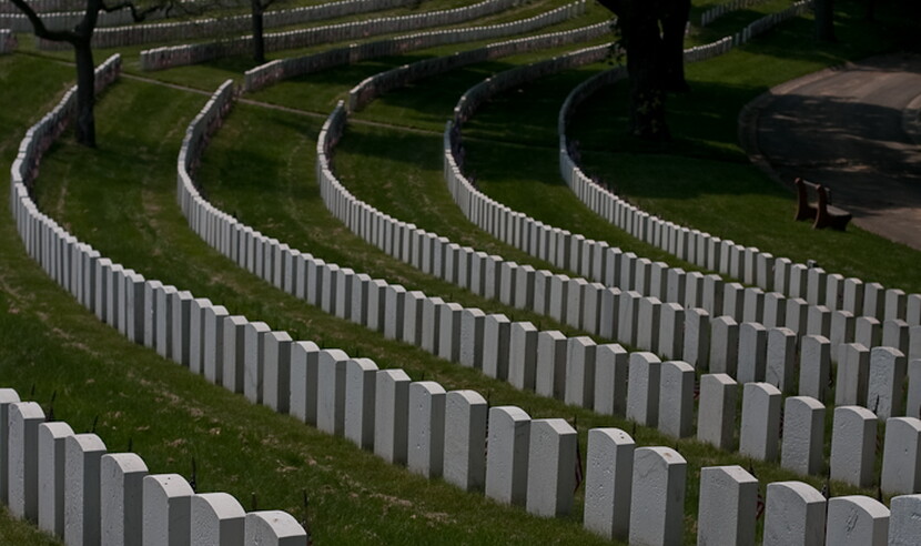 View of curving lines of gravestones at Cypress Hills National Cemetery
