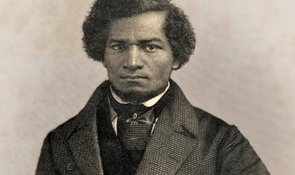 An engraving of Frederick Douglass as a young man, wearing a double-breasted jacket, vest or waistcoat, and scarf, looking fiercely into the camera
