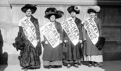 1909 photo of 4 women strikers on a picket line