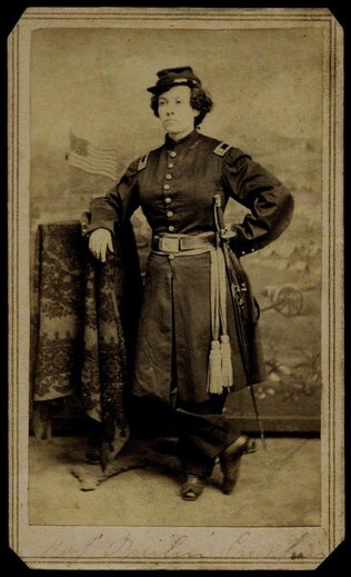 Full-length pose in uniform with sword. Cushman served as a Union spy in Kentucky and Tennessee.