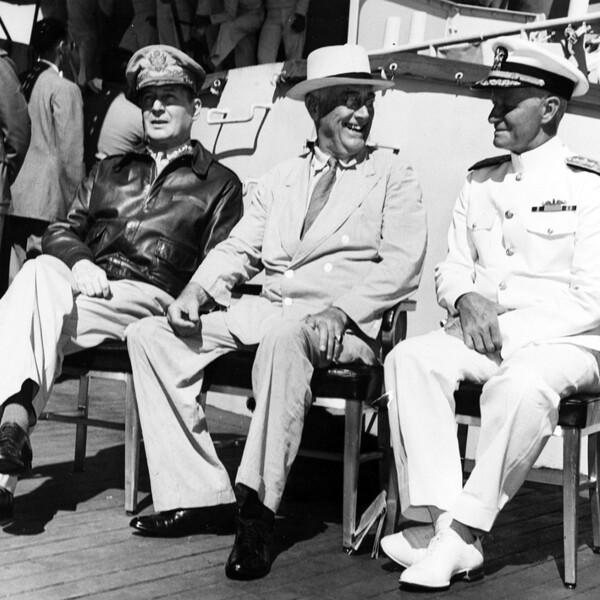 On board USS Baltimore (CA-68), at Pearl Harbor, Hawaii, 26 July 1944. Admiral William D. Leahy, the President's Chief of Staff, is standing in the left background. Official U.S. Navy Photograph, now in the collections of the National Archives