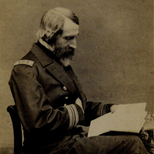 Black and white photograph showing a Civil War soldier reading