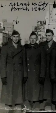 Crop of black and white photograph with soldiers, including one noted to be "Al in Atlantic City, March 1943"