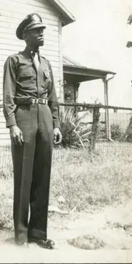 Photograph of soldier in military uniform.
