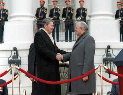 Photograph showing Ronald Reagan and Mikhail Gorbachv shaking hands