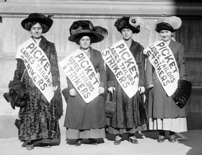 1909 photo of 4 women strikers on a picket line