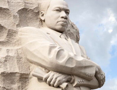 Photograph of large sculpture of Martin Luther King Jr. carved out of stone. 