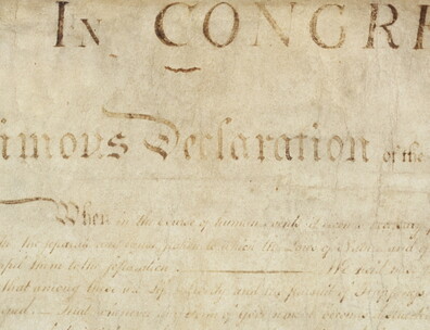 Engrossed copy of the Declaration of Independence focused on word Declaration