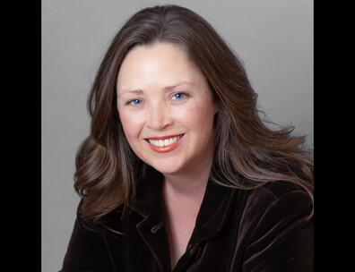 A headshot of author Molly Beer.