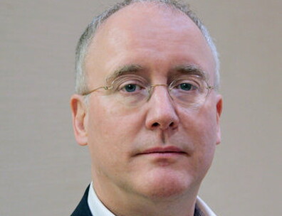 A headshot of David Armitage.
