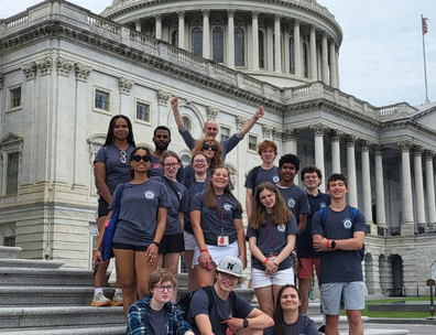 group of Washington College Quill & Compass students posed on the steps of the US Capital building