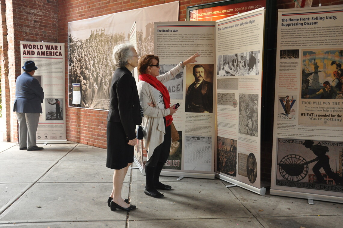 Two people view the WWI exhibition on display