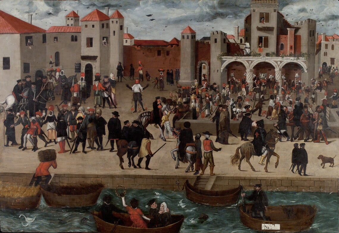 A port in a medieval city, with people on boats and walking about on land.