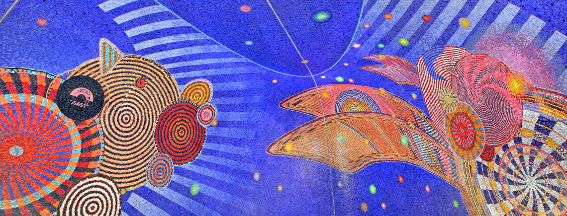 A panoramic image of a mosaic featuring spirals and circles on a blue field, and, at left in the mosaic, an Atlantic Records vinyl record