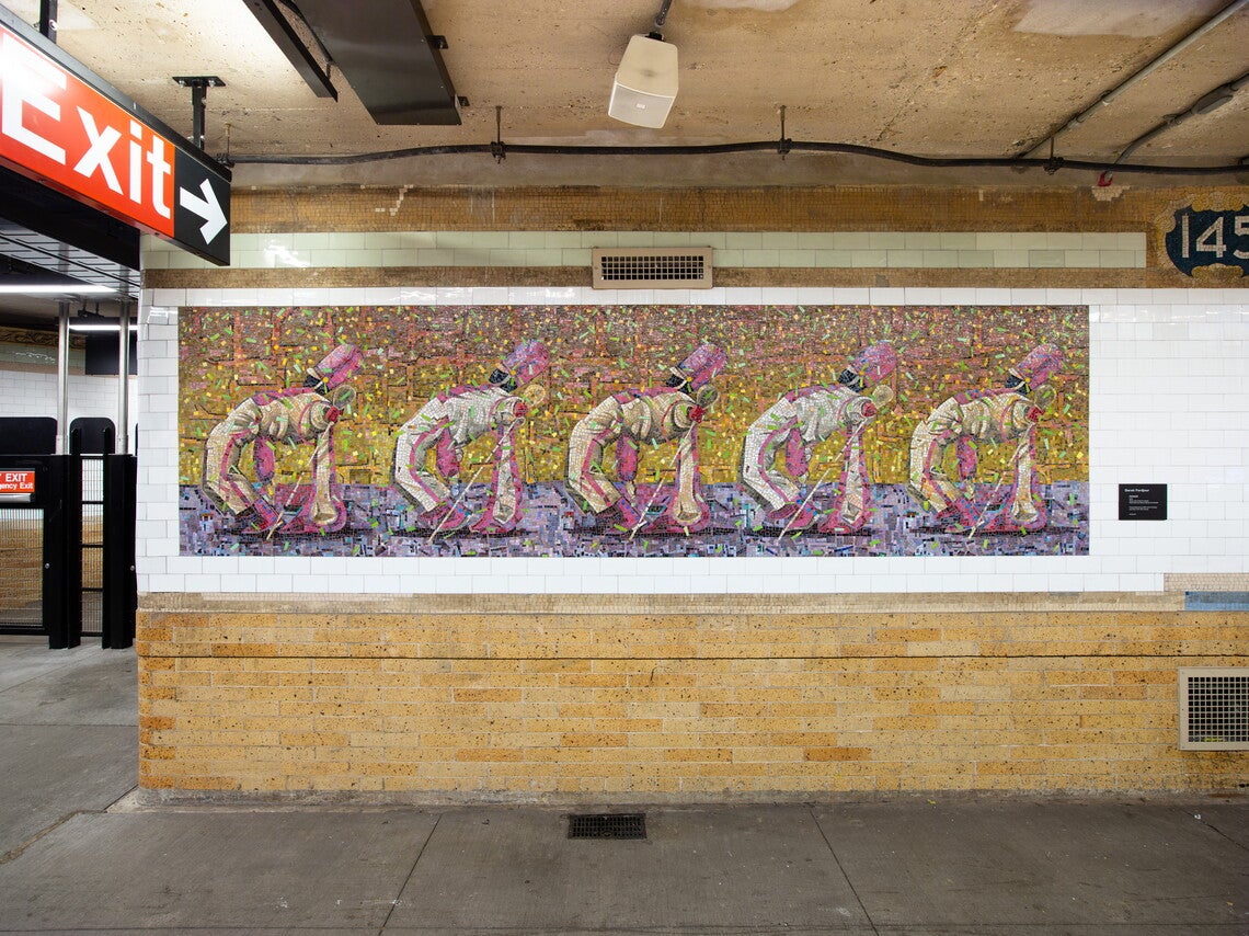 A tile mosaic in a subway station of drum majors in white uniforms dancing in formation.