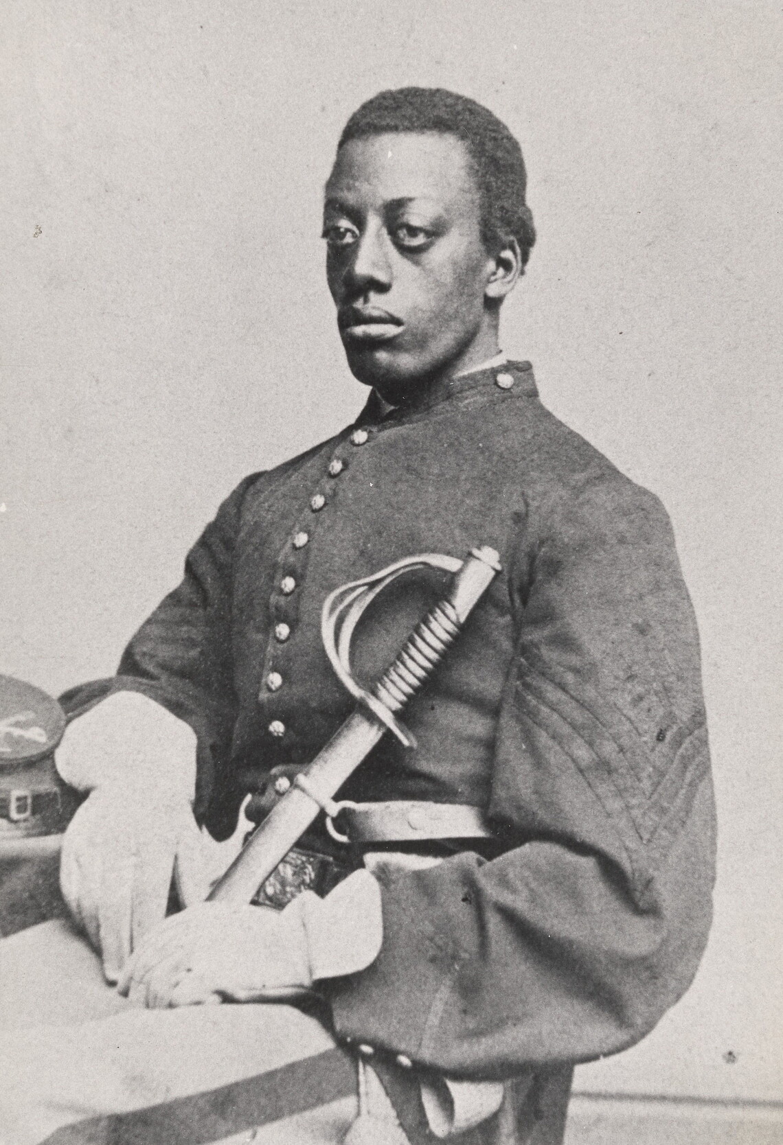 Photograph of Charles Remond Douglass (one of Frederick Douglass’s sons), seated with sword, ca. 1864 (Randolph Linsly Simpson African-American Collection, Beinecke Rare Book and Manuscript Library, Yale University)