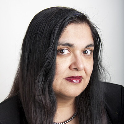 A headshot of Sinha Manisha.