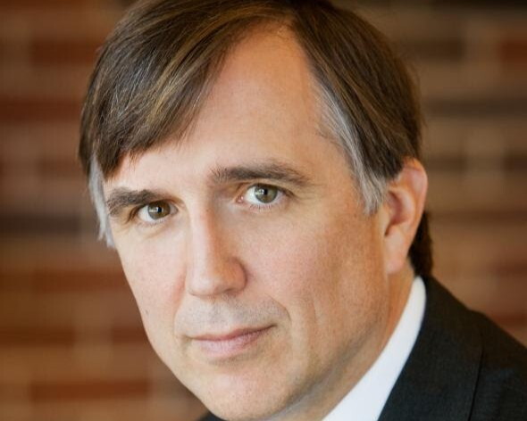 A man with salt-and-pepper hair.