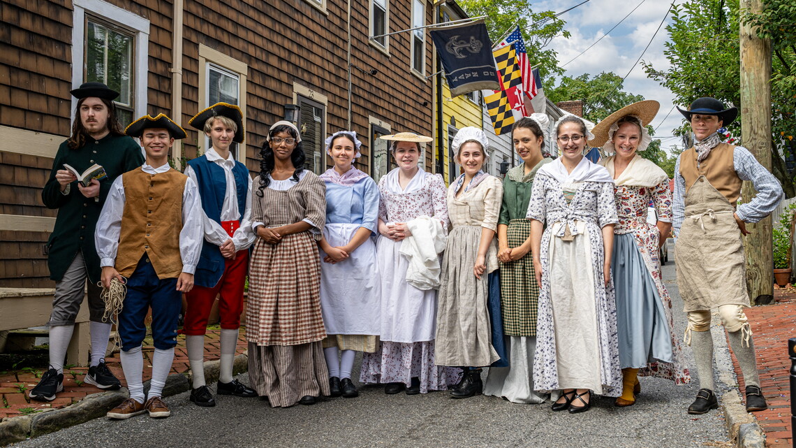 Students in colonial era costumes on Pinkney Street, a contributing resource in the Colonial Annapolis Historic District, a National Historic Landmark District.